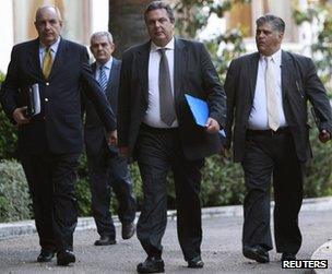 Independent Greeks party leader Panos Kammenos (2nd R) leaves the presidential mansion in Athens, 13 May