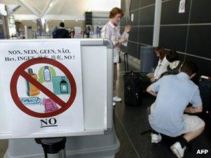 Airport sign prohibiting liquids in luggage