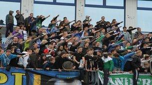 Supporters doing Nazi salute at a Ukrainian football stadium