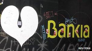 The logo of the Bankia bank is seen on a wall in Madrid