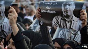 Protesters in Bahrain hold up a picture of human rights activist Nabeel Rajab at a rally south of the capital Manama on May 11.