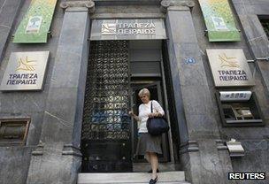 Woman leaving a Greek bank