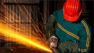 worker using angle grinder cutter