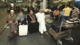 Passengers wait for flights at Tripoli International Airport on Tuesday
