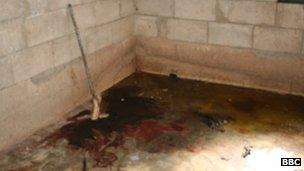 Blood on the floor of a house in Qubair