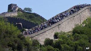 Tourists go sightseeing on the Great Wall of China during a weekend at Badaling June 2 2012