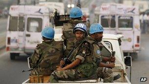UN soldiers from Niger conduct a patrol through the streets of Abidjan on 10 January 2011.