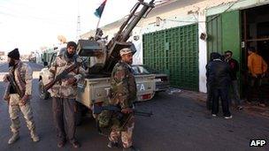 Former Libyan rebels securing a street in the Libyan desert city of Kufra, March 2012 file pic