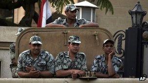 Egyptian soldiers stand guard in Cairo, Egypt, Monday, May 28, 2012.