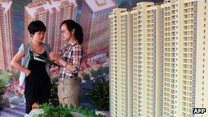 A buyer looking at property broacher in China