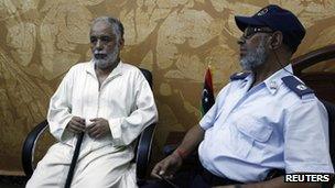 Deposed Libyan leader Muammar Gaddafi's former prime minister al-Baghdadi al-Mahmoudi sits in the office of his prison guard in Tripoli after being extradited from Tunis on June 24