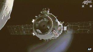 The orbiting Tiangong-1 space lab as seen from the Shenzhou-9 spacecraft, 24 June 2012
