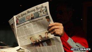 A man reads the Sydney Morning Herald newspaper on 20 June, 2012 in Sydney, Australia