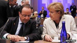 French President Francois Hollande talks with German Chancellor Angela Merkel
