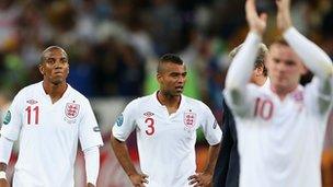 Ashley Cole and Ashley Young of England look dejected after defeat during the UEFA EURO 2012 quarter final match between England and Italy