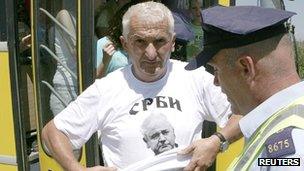 A Serb man with a t-shirt showing Slobodan Milosevic