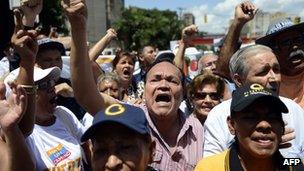People demonstrate in support of Globovision outside the court in Caracas