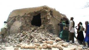 A still from a video shows Islamist militants destroying an ancient shrine in Timbuktu on July 1