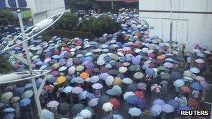 Residents at a municipal government building in Shifang city, Sichuan province