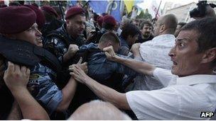 Riot police block opposition supporters on July 3, 2012 during a rally against a controversial Russian language bill in Kiev