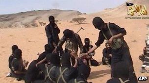 A screen shot of a video posted on the Internet on October 6, 2010 shows militants from Al-Qaeda in the Arabian Peninsula.