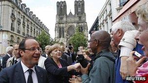 Francois Hollande and Angela Merkel meet the crowds in Reims. Photo: 8 July 2012