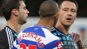 Anton Ferdinand and John Terry during the match at Loftus Road