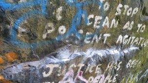 Text painted on a boulder