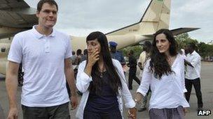 Spaniards Enric Gonyalons and Ainhoa Fernandez Rincon, and Italy's Rossella Urru, arrive at an airport in Ouagadougou, Burkina Faso on Thursday after being freed by kidnappers in Mali