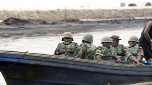 Soldiers in a boat in the Niger Delta (archive shot)