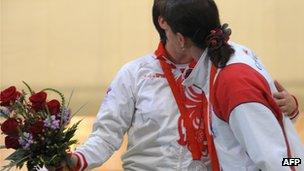 Nino Salukvadze and Natalia Paderina embrace at the 2008 Olympics