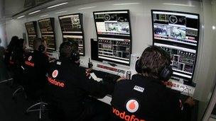 F1 engineers in garage