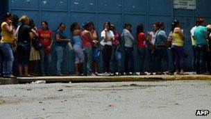 Women wait in line in Venezuela