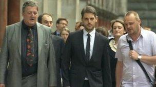Paul Chambers arriving at court with Stephen Fry and Al Murray