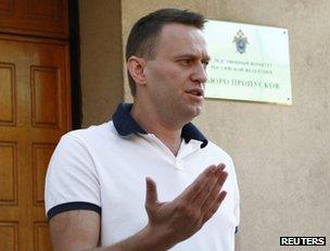 Alexei Navalny speaks to reporters outside the offices of the Investigative Committee in Moscow, 31 July