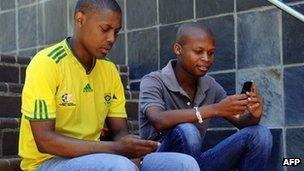 Students use their mobile phones in Johannesburg (archive shot)