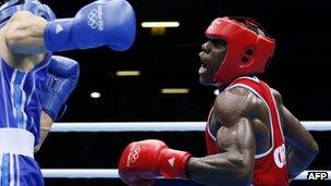 Serge Ambomo boxing against Yakup Sener of Turkey at the London 2012 Olympics