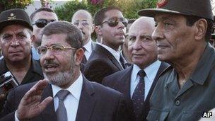 Egyptian President Mohammed Mursi and Field Marshal Gen Hussein Tantawi, right