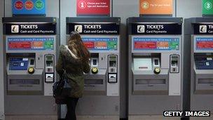 Lady buys a ticket at Clapham Junction