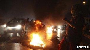 Tyres burn on the main road leading to Beirut airport (15 Aug 2012)
