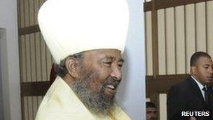 Egypt"s President Mohamed Mursi (R) shakes hand with Patriarch of the Ethiopian Orthodox Church Abune Paulos in Addis Ababa on 16 July 2012