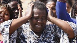 A woman cries as she protests against police near the Lonmin mine in South Africa. Photo: 17 August 2012