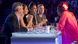 X Factor judges with contestant Sheyi