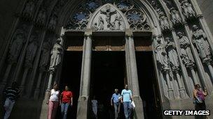 Catholic worshippers leave the Se cathedral in downtown Sao Paulo, Brazil, after praying on 29 March 2008