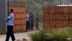 Chinese police outside the Number Two prison after the release of dissident Wang Xiaoning in Beijing on 31 August, 2012