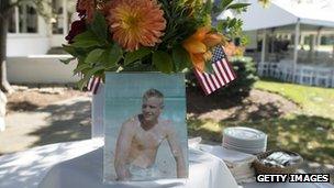 A photograph of Neil Armstrong as a young man is displayed on a table during a memorial service in Ohio. Photo: 31 August 2012