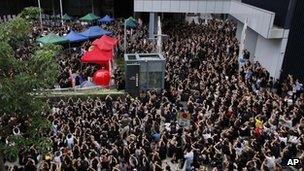 Thousands of protesters, parents, and their children gather outside the government headquarters in Hong Kong on Monday 3 Sep 2012