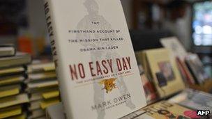 Copies of a book by former Navy SEAL titled "No Easy Day" are seen on display at a bookstore in Washington, DC