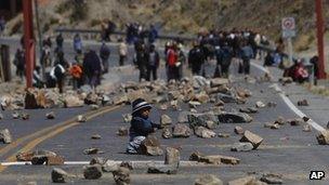A miner's son plays on a road leading to La Paz on 11 September 2012
