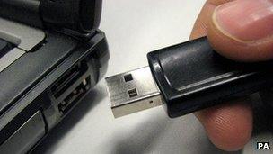 File photo dated 22 August, 2008 of a USB (Universal Serial Bus) memory stick being inserted into a laptop computer